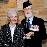 Irene Coghill and Pipe Major CWO (retd) Jack Coghill with the medal